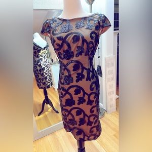 Elegant formal dress to knee. Black sequent with mesh and nude/tan lining.